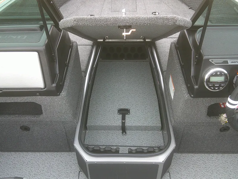 Slide: The Image of 2025 Lund 1875 Impact XS Sport boat interior storage compartment open. - 14