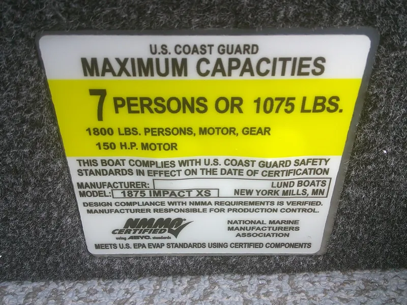 Slide: The Image of U.S. Coast Guard capacity label for 2025 Lund 1875 Impact XS Sport boat, 7 persons or 1075 lbs. - 19