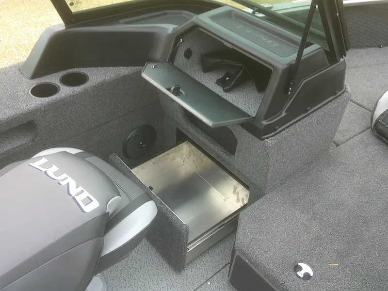 Slide: The Image of 2025 Lund 1875 Impact XS Sport boat interior with storage compartments and seating. - 20