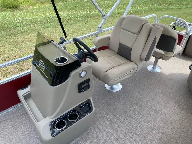 Slide: The Image of 2025 Sun Tracker Bass Buggy 18 DLX interior with steering console and seating. - 8