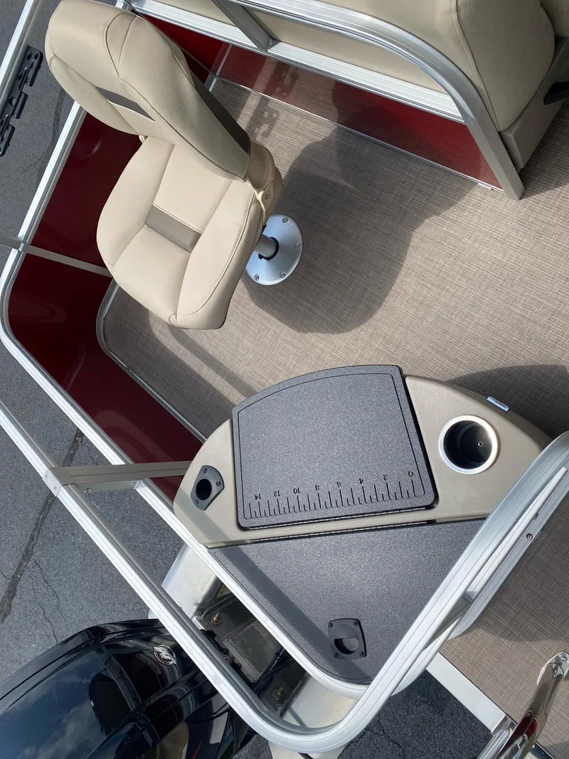 Slide: The Image of 2025 Sun Tracker Bass Buggy 18 DLX interior with seating and fishing station. - 9