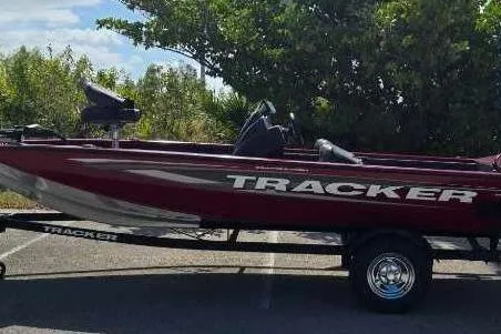 The Image of 2025 Tracker Pro Team 175 Crappie Edition boat on trailer, parked outdoors. - 0