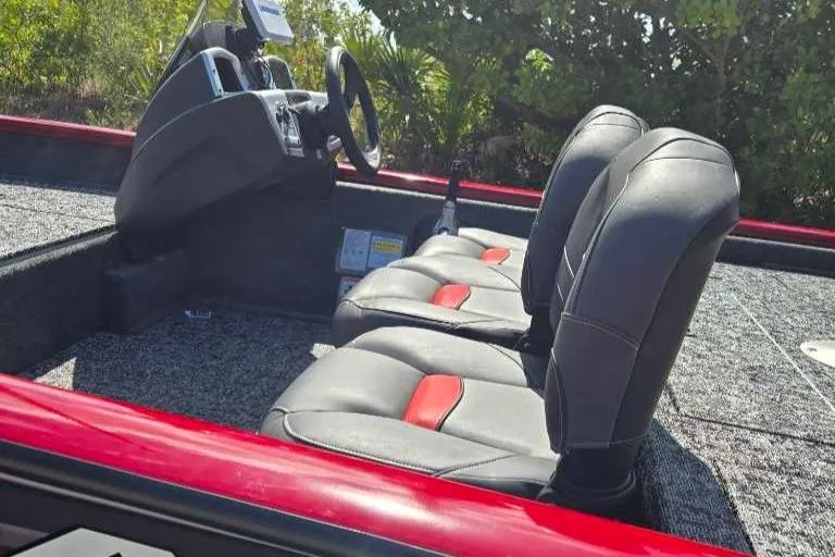 Slide: The Image of 2025 Tracker Pro Team 175 Crappie Edition boat interior with dual seats and steering console. - 10