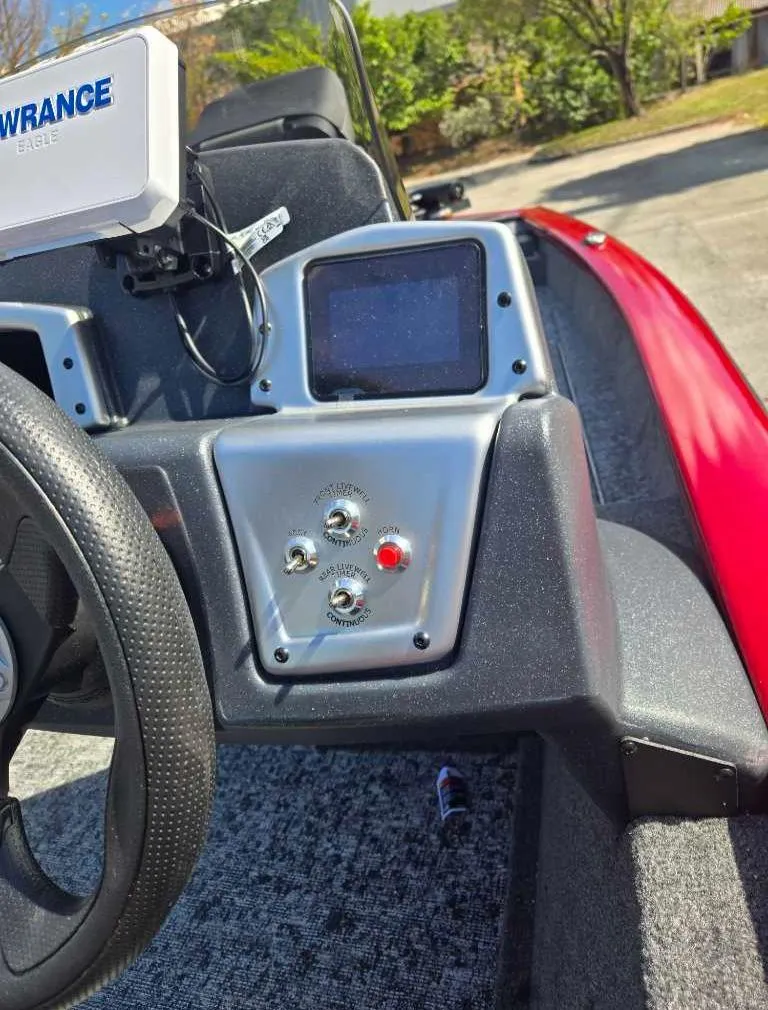 Slide: The Image of 2025 Tracker Pro Team 175 Crappie Edition boat dashboard with navigation equipment. - 4