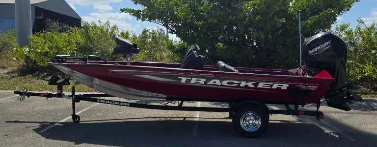 Slide: The Image of 2025 Tracker Pro Team 175 Crappie Edition boat on trailer, parked outdoors. - 81