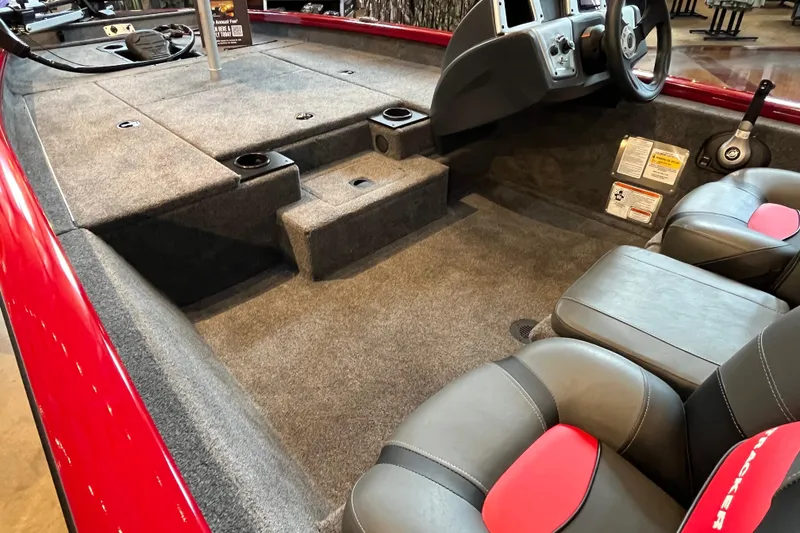 Slide: The Image of Interior of 2025 Tracker Pro Team 175 boat with gray seating and red accents. - 4