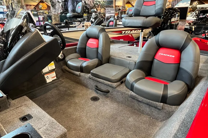 Slide: The Image of 2025 Tracker Pro Team 175 boat interior with gray and red seating. - 5