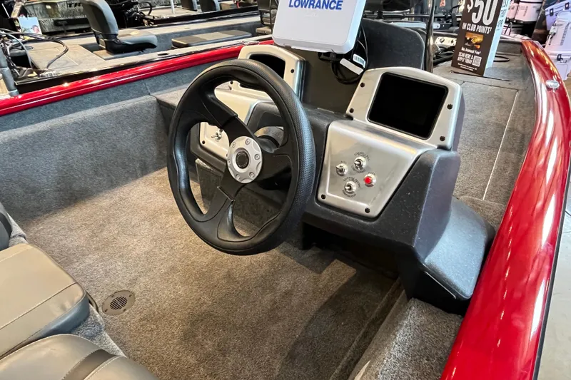 Slide: The Image of 2025 Tracker Pro Team 175 boat interior with steering wheel and control panel. - 7
