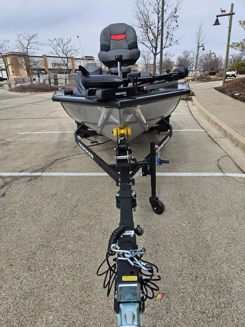 Slide: The Image of 2025 Tracker Pro Team 175 boat on trailer in parking lot. - 3