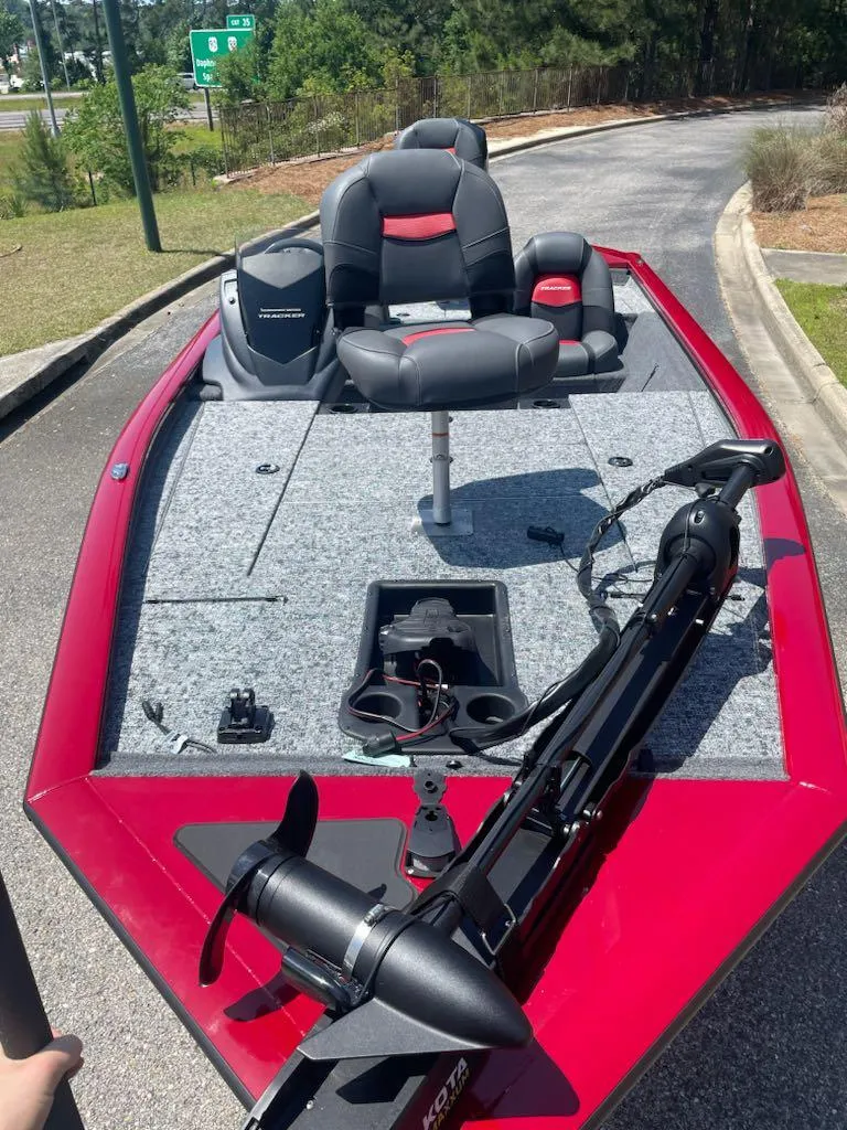 Slide: The Image of 2025 Tracker Pro Team 195 Tournament Edition boat with red trim and seating. - 4