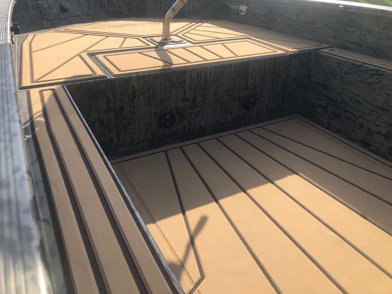 Slide: The Image of 2025 Tracker Grizzly 1650 T Prairie Wings Edition boat interior with custom flooring. - 8