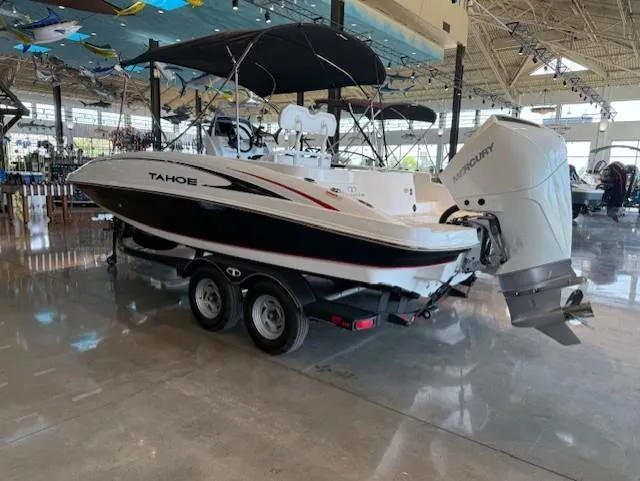 Slide: The Image of 2023 Tahoe 2150 CC boat with Mercury engine on display in showroom. - 1