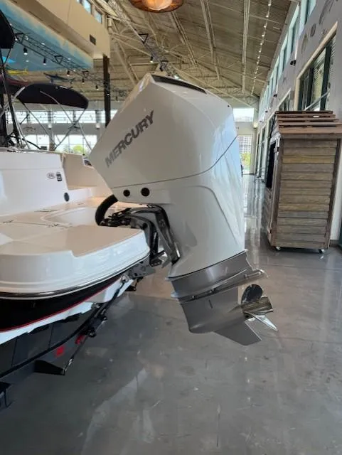 Slide: The Image of 2023 Tahoe 2150 CC boat with Mercury outboard motor in showroom. - 3