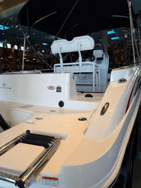 Slide: The Image of 2023 Tahoe 2150 CC boat with sleek white design and comfortable seating. - 4
