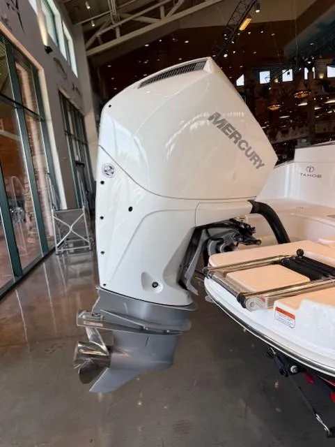 Slide: The Image of 2023 Tahoe 2150 CC boat with Mercury outboard motor in showroom. - 8