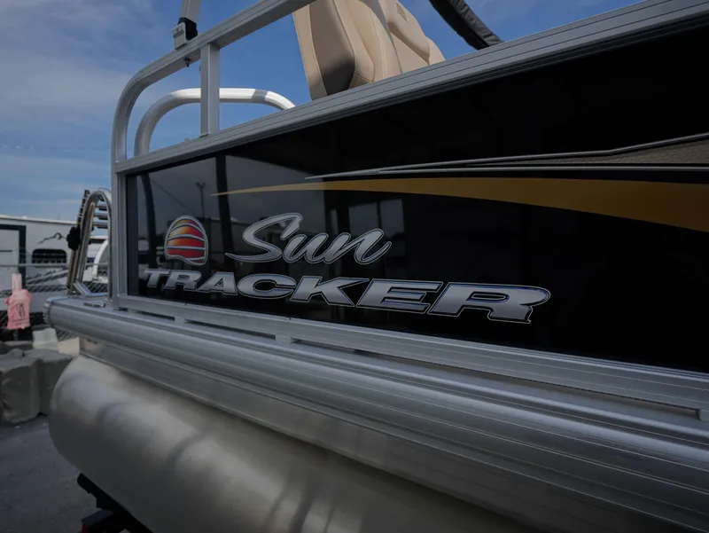 Slide: The Image of 2025 Sun Tracker Party Barge 16 DLX pontoon boat, side view with logo. - 10