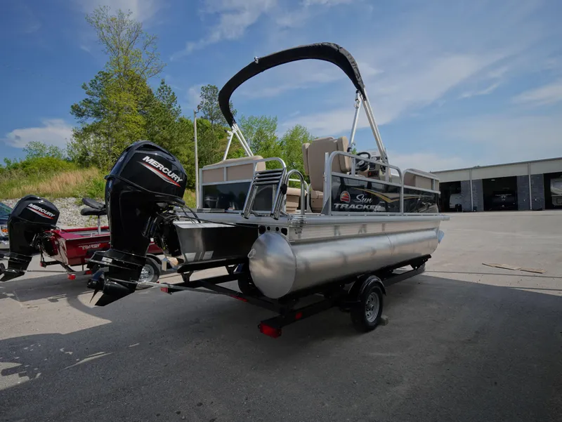 Slide: The Image of 2025 Sun Tracker Party Barge 16 DLX pontoon boat with Mercury outboard motor. - 4