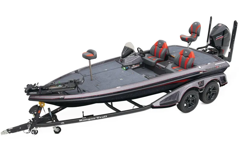 The Image of 2025 Ranger Z519R boat on trailer, parked outside a wooden building. - 0