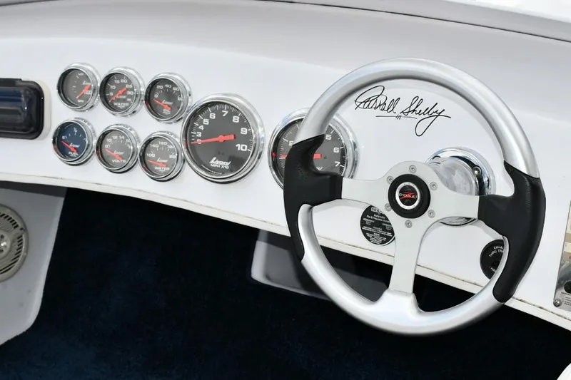 Slide: The Image of Dashboard of a 2007 Donzi Carol Shelby 22 Classic with gauges and signed steering wheel. - 11