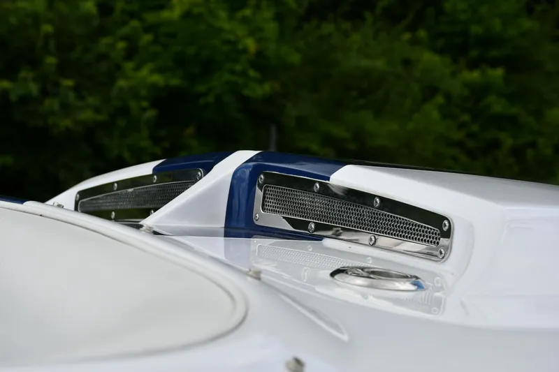 Slide: The Image of 2007 Donzi Carol Shelby 22 Classic boat with sleek design and air vents. - 13