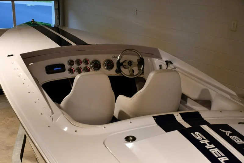 Slide: The Image of 2007 Donzi Carol Shelby 22 Classic boat interior with steering wheel and gauges. - 15