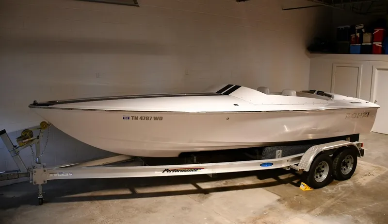 Slide: The Image of 2007 Donzi Carol Shelby 22 Classic boat on trailer in garage. - 17