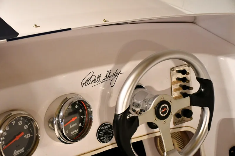 Slide: The Image of 2007 Donzi Carol Shelby 22 Classic dashboard with signature, steering wheel, and gauges. - 18