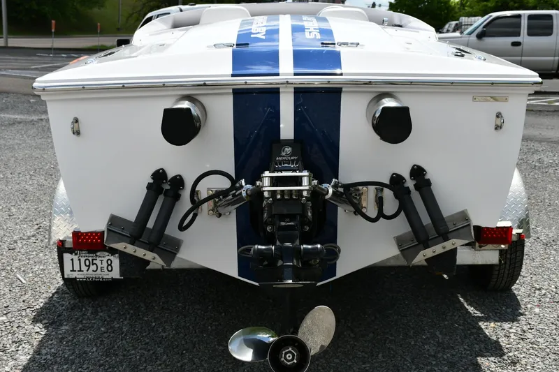Slide: The Image of Rear view of 2007 Donzi Carol Shelby 22 Classic boat with blue racing stripe. - 5