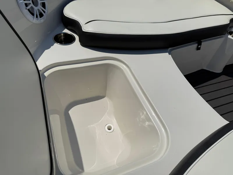 Slide: The Image of 2020 Stingray 191 DC boat interior with seating and storage compartment. - 10