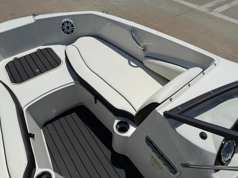 Slide: The Image of 2020 Stingray 191 DC boat interior with white seating and black accents. - 12