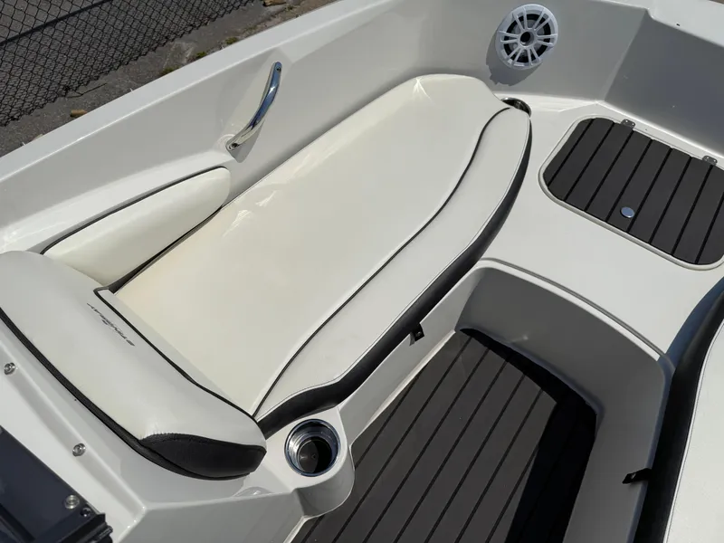 Slide: The Image of 2020 Stingray 191 DC boat interior with white seating and black accents. - 13