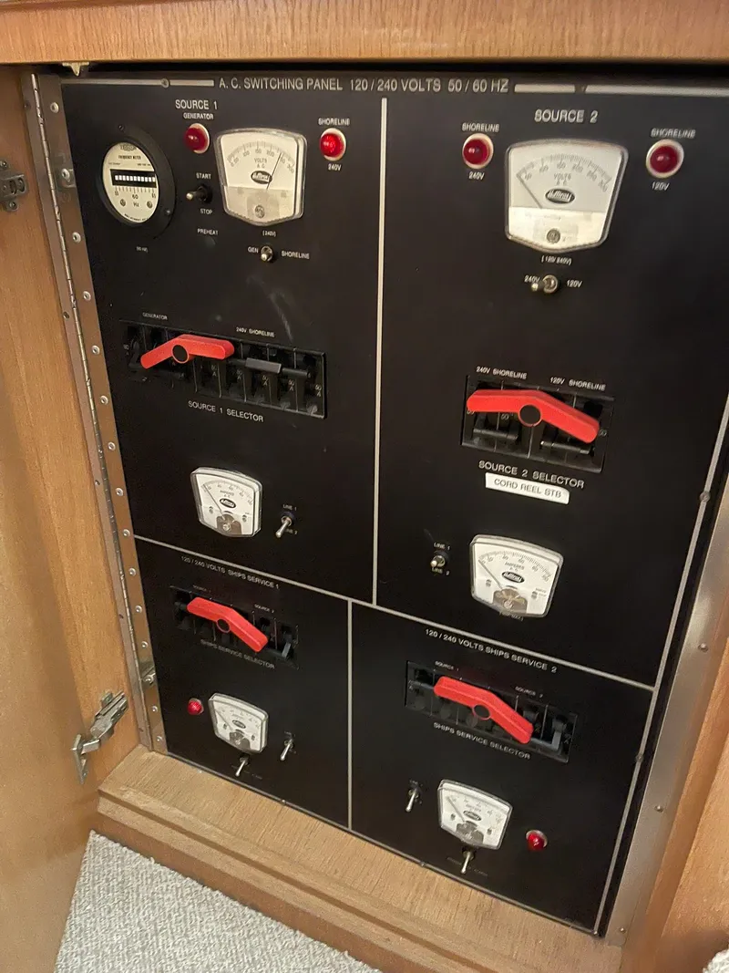 Slide: The Image of Electrical panel on a 1995 Hatteras 52 Motor Yacht, featuring switches and meters. - 20