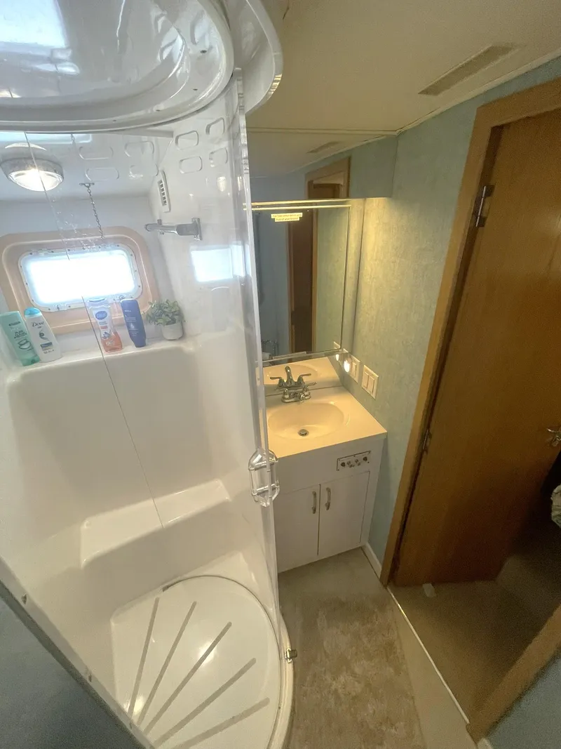 Slide: The Image of Bathroom interior of 1995 Hatteras 52 Motor Yacht with shower and vanity. - 33