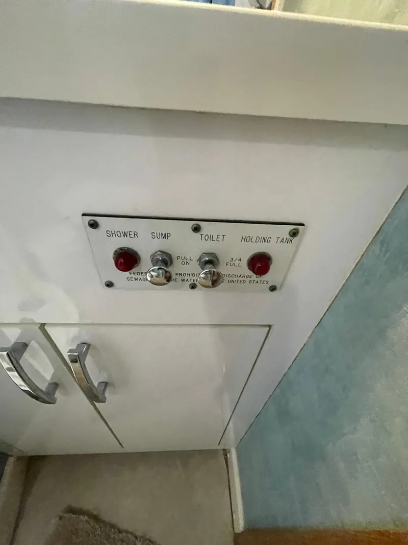 Slide: The Image of Control panel on 1995 Hatteras 52 Motor Yacht for shower, sump, toilet, holding tank. - 35