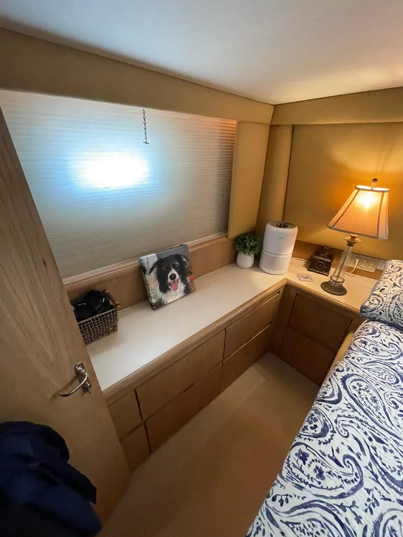 Slide: The Image of Cozy cabin interior of 1995 Hatteras 52 Motor Yacht with lamp and decorative items. - 40