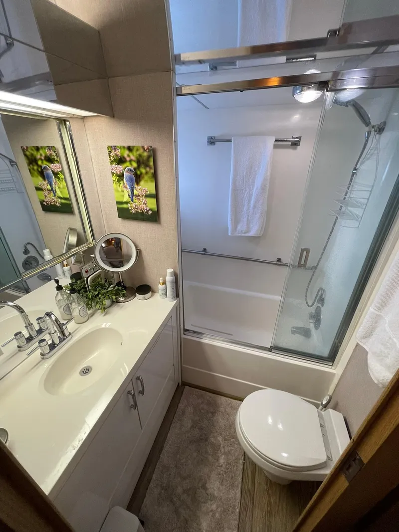 Slide: The Image of Bathroom interior of 1995 Hatteras 52 Motor Yacht with shower, sink, and decor. - 44