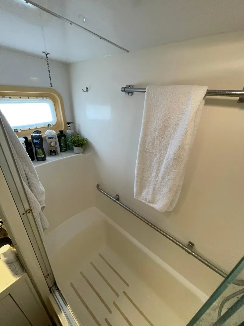 Slide: The Image of Bathroom of 1995 Hatteras 52 Motor Yacht with towel and toiletries. - 46