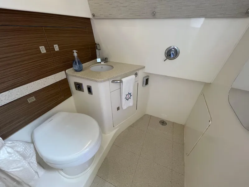 Slide: The Image of Luxurious bathroom interior of 2017 Boston Whaler 420 Outrage boat, featuring modern amenities. - 13