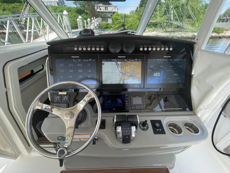 Slide: The Image of 2017 Boston Whaler 420 Outrage helm with advanced navigation displays and controls. - 8