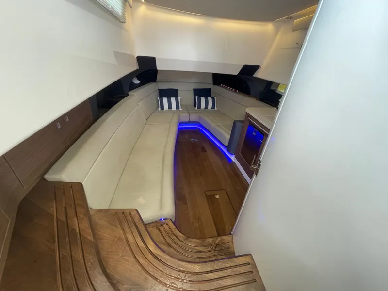 Slide: The Image of Luxurious interior of 2017 Boston Whaler 420 Outrage with elegant seating and ambient lighting. - 9