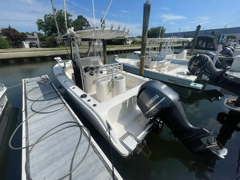 Slide: The Image of 2005 McKee Craft Freedom 22 CC boat docked with Yamaha outboard motor. - 28