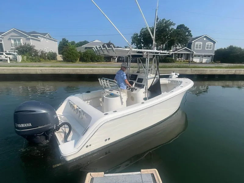 Slide: The Image of 2005 McKee Craft Freedom 22 CC boat with Yamaha engine on calm water. - 31