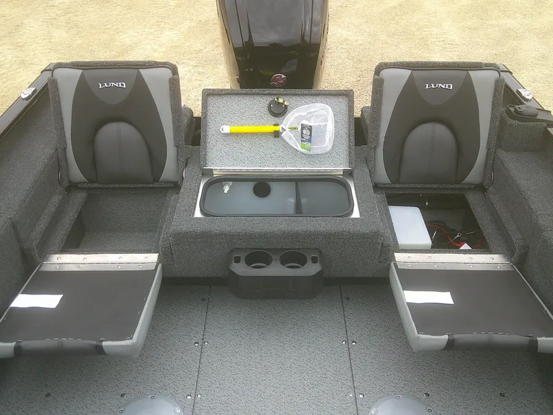 Slide: The Image of 2025 Lund 1775 Adventure SS boat interior with seating and storage compartments. - 11