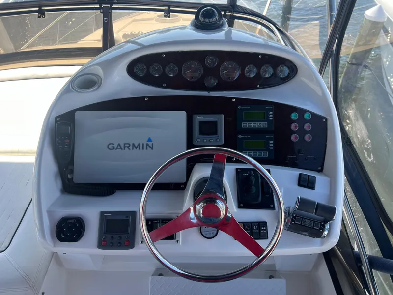 Slide: The Image of 2008 Sunseeker Manhattan 50 helm with Garmin navigation system and red-accented steering wheel. - 13