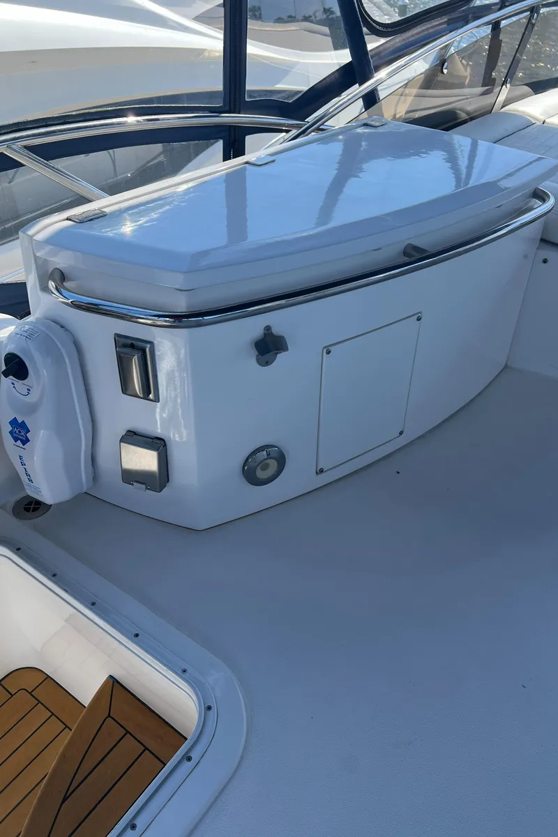 Slide: The Image of 2008 Sunseeker Manhattan 50 yacht deck with storage compartment and controls. - 16