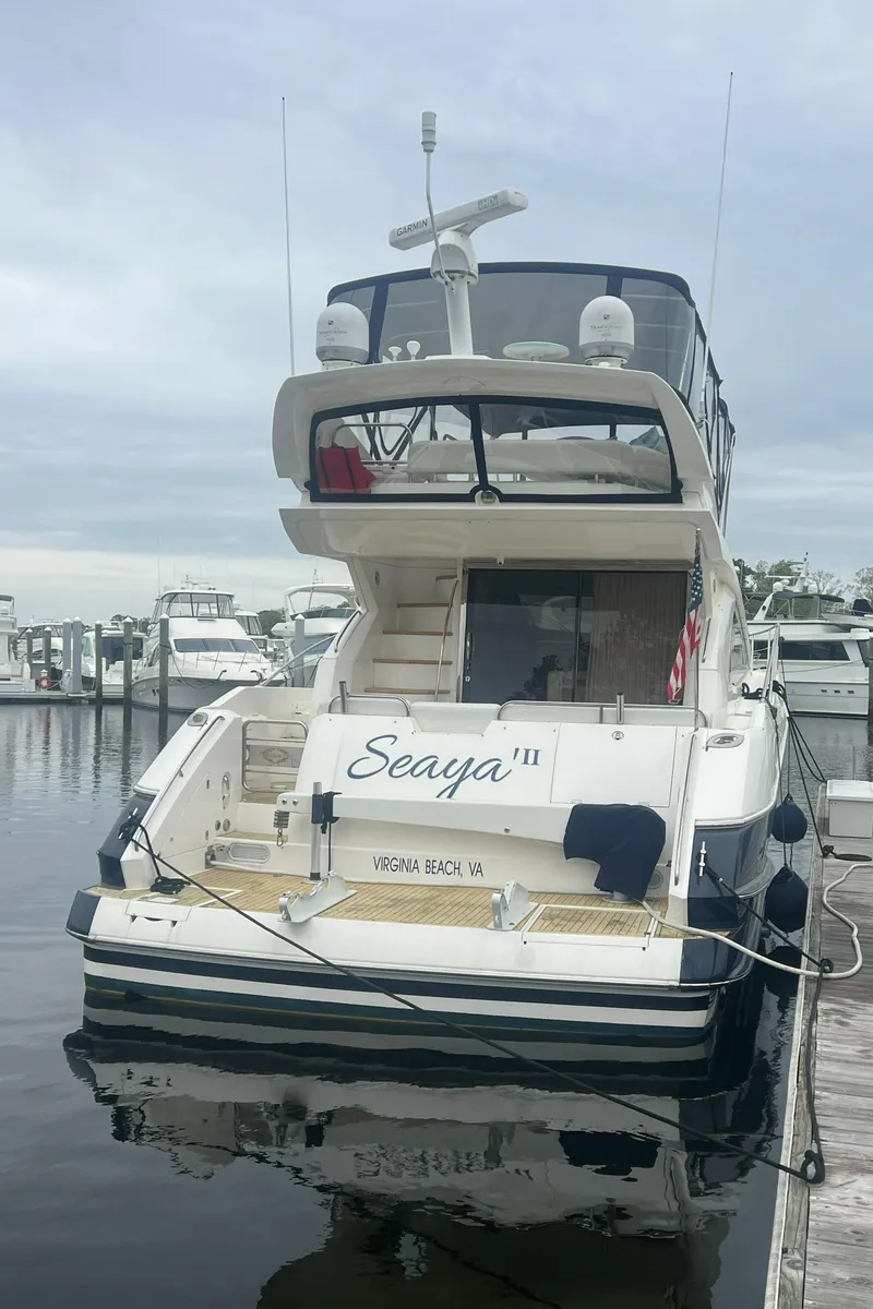 Slide: The Image of 2008 Sunseeker Manhattan 50 yacht docked at marina, rear view. - 2