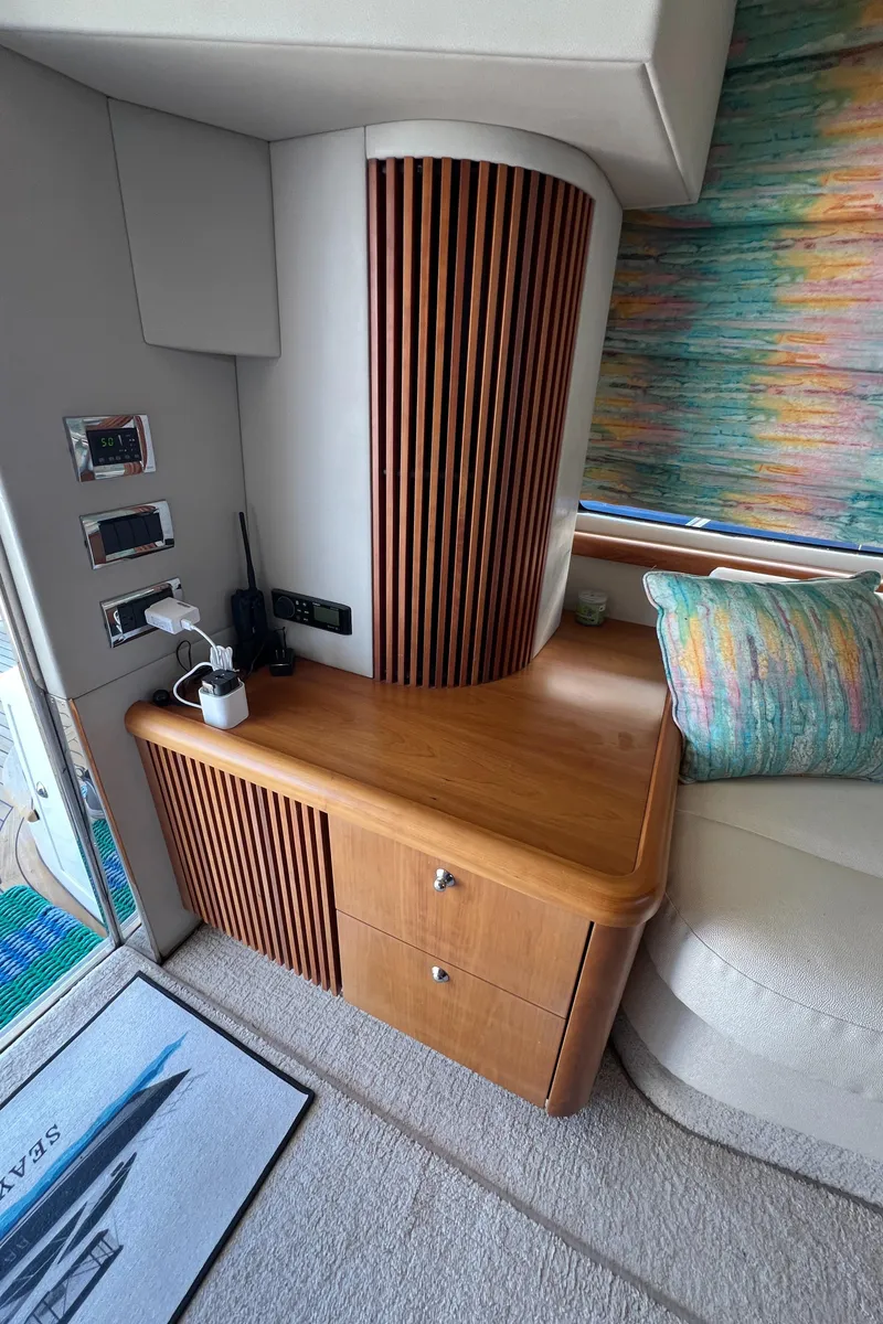 Slide: The Image of 2008 Sunseeker Manhattan 50 yacht interior with wooden cabinetry and colorful decor. - 23