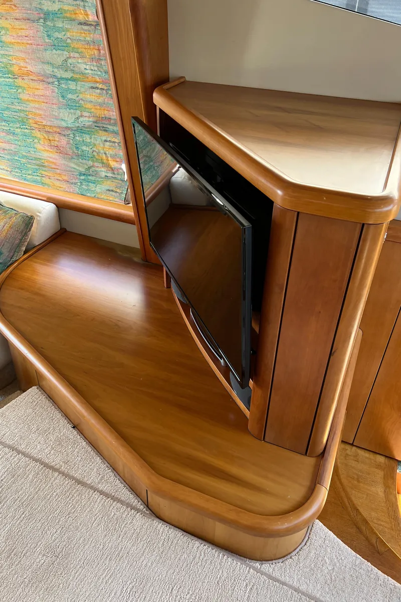 Slide: The Image of Interior of 2008 Sunseeker Manhattan 50 yacht with wooden cabinetry and built-in TV. - 25