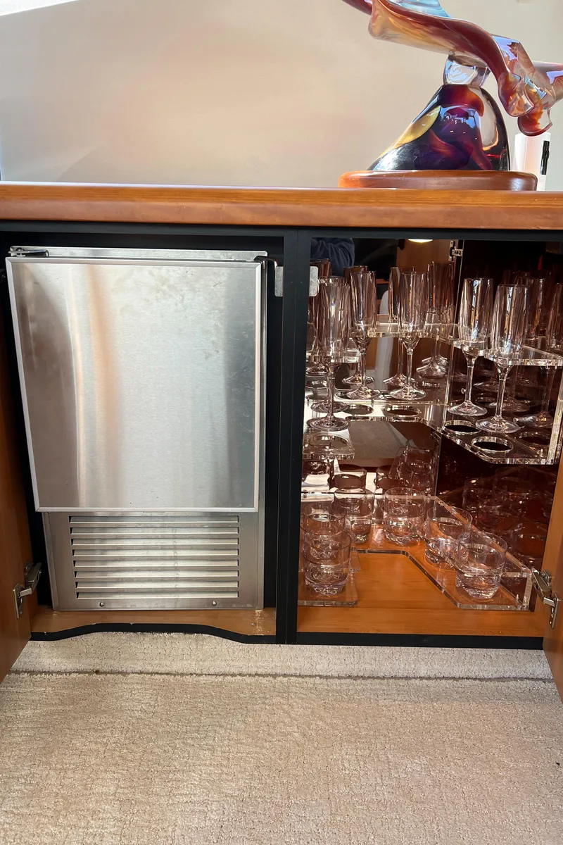 Slide: The Image of Luxury yacht Sunseeker Manhattan 50 bar area with glassware and mini fridge, 2008 model. - 28