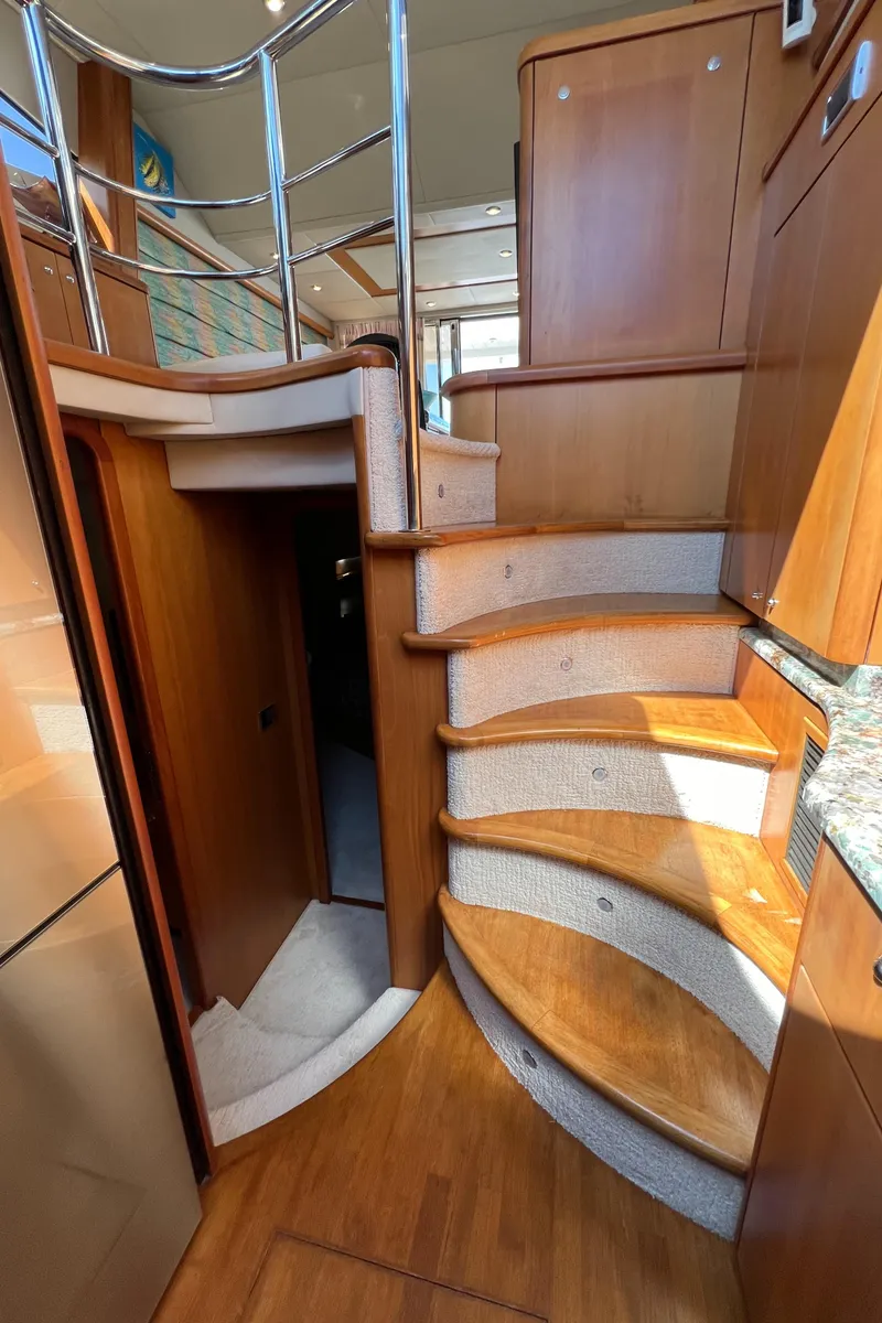 Slide: The Image of Interior staircase of 2008 Sunseeker Manhattan 50 yacht, featuring elegant wood finish. - 43